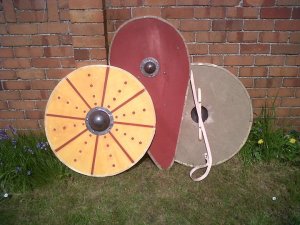 Front and back of a round shield, and a kite shield